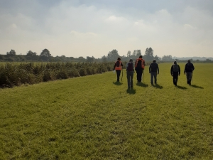 People walking across field