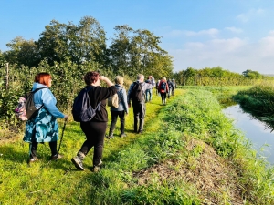 Walkers along the river